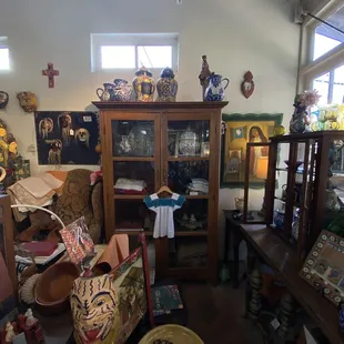 Art work in La Cabana plus a wood cabinet full of authentic talaverra pottery.