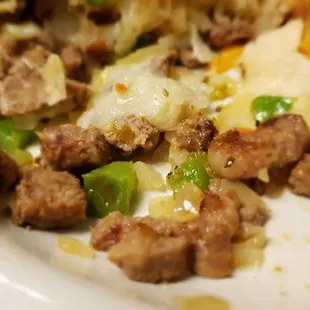 The steak burrito has steak, green peppers and mozzarella inside