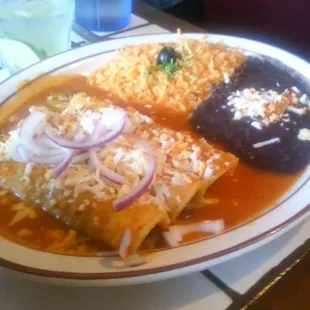 Entomatadas $11.95. Corn tortillas filled w/chicken breast, topped w/tomato sauce, cheese &amp; sour cream.