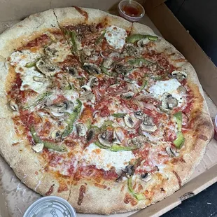 Whole wheat Luna pizza with shrooms, garlic, peppers and onions