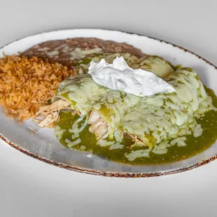 Enchilada Dinner:
Three chicken enchiladas with refried beans and
rice, topped with green salsa, cheese and sour cream.