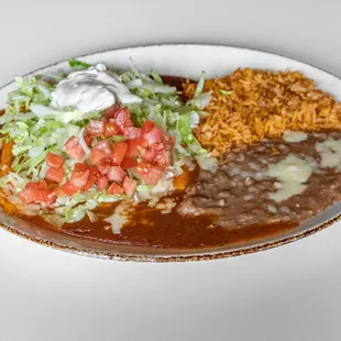 7 Enchiladas Deluxe:
Three cheese enchiladas topped with lettuce,
tomatoes and sour cream. Served with 
rice and beans