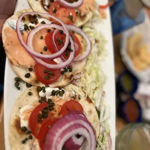 a person holding a plate of food