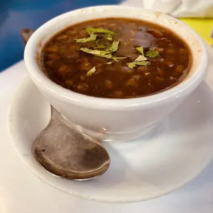 a bowl of soup and a spoon
