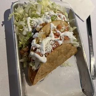 One grilled chicken one shredded chicken taco