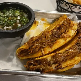 Birria Tacos~ The corn tortillas were nice &amp; crispy, the birria could use flavor. Taste amazing in their consome tho!