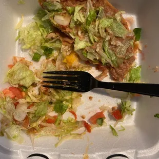 a fork in a styrofoam container