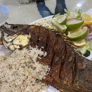 Deep fried red snapper with fried rice and salad