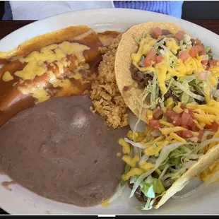 A chalupa, crispy taco, a cheese enchilada, rice, and beans