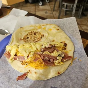 A fat sausage, egg, and cheese taco