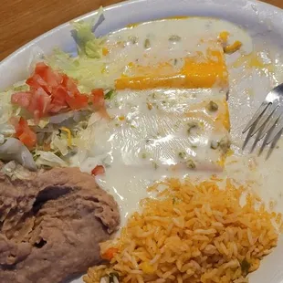 Cheese enchiladas with queso on top.