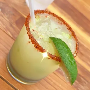 a margarita with a lime garnish