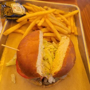 a sandwich and french fries on a tray