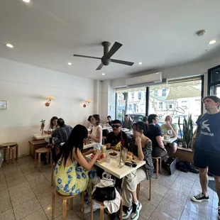 a group of people eating in a restaurant