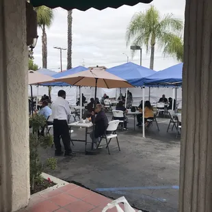 Nice outdoor patio setup!  Takeout booth outside away from people.