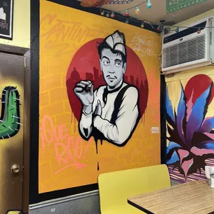 a mural of a man holding a cigarette