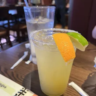 a drink with a slice of lime on the rim