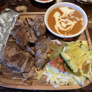 a plate of meat and vegetables
