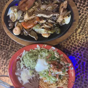 Trio Fajitas Shrimp, Steak and Chicken with sautéed vegetables