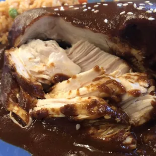 Close up view of Chicken with Mole... boneless tender chicken breast, very flavorful sauce.