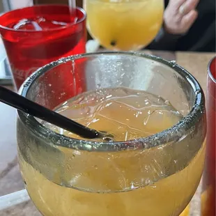 Peach margarita in front and Peach daiquiri in the background. Both were delicious