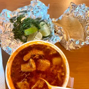 a bowl of soup and tortilla