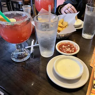 a table with drinks and condiments