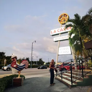 a woman standing in front of a sign