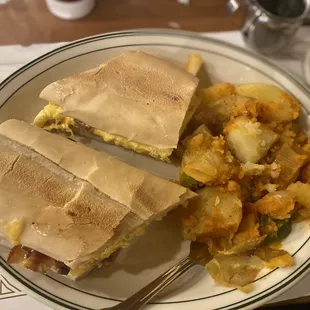 Egg bacon and cheese sandwich  Home fries