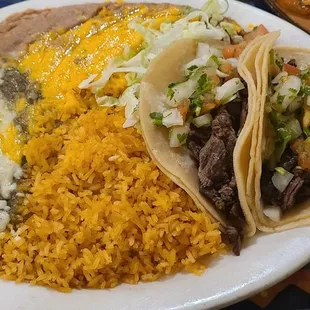 Carne asada tacos and chicken enchilada