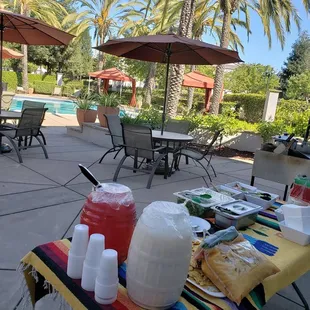 a table with drinks and condiments
