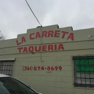 a car parked in front of a building
