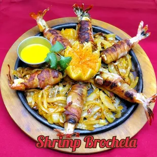 Try the  fresh Shrimp  Brocheta . Served with rice ,Beans, pico de gallo  guacamole &amp; tortillas.