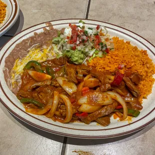Bistec picado ranchera sauce with hot sauce mixed together creating a delicious plate ‍