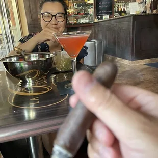 a woman smoking a cigar