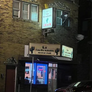 a car parked in front of a restaurant