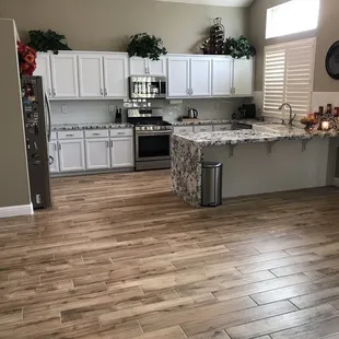 a kitchen with wood flooring