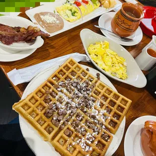 Ahhh!  Deliciousness all around! Bacon &amp;Cheese Omelette with avocado, Chocolate Chips Waffles w/eggs &amp; bacon.