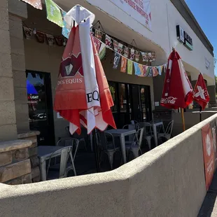 tables and umbrellas outside a restaurant