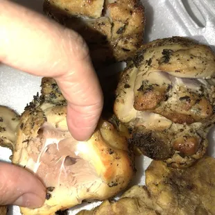 a person picking a piece of bread