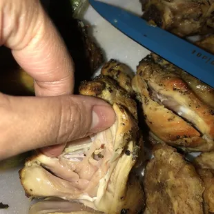 a person holding a knife over a plate of food