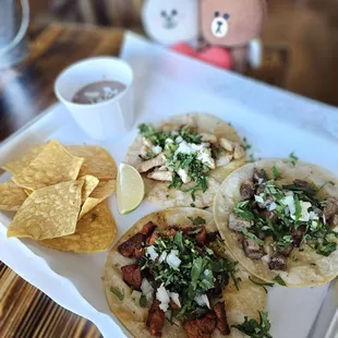Three tacos plate comes with chips and beans