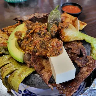 Molcajete Cielo, Mar Y Tierra ($32.99). Comes with rice, beans, and tortilla on the side. So good - highly recommend! 7/3/2022