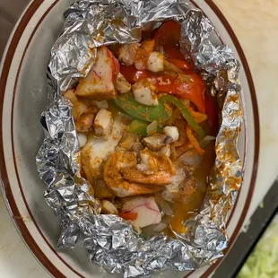 a bowl of shrimp and vegetables