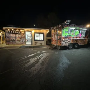 a food truck parked in front of a restaurant