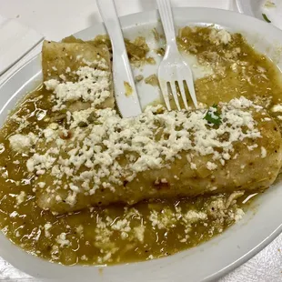 Chicken enchiladas with green sauce.