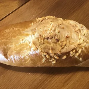 a piece of bread on a wooden table