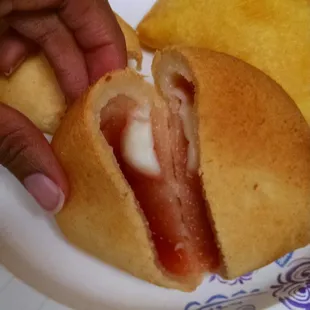 Inside of a pan de bono con guava
