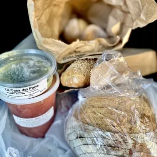 Meatballs in red sauce, pesto, Italian dinner rolls, sesame seed baguette &amp; round boule sliced to go. YUM! :)...