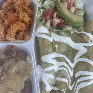 Chicken enchiladas with green sauce.
